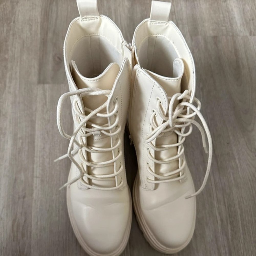 Cream women’s chunky boots used.